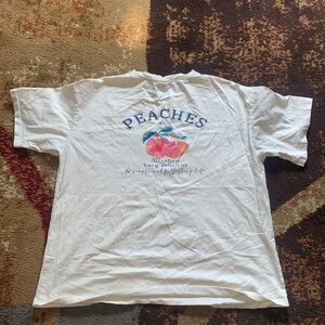 Tan t-shirt with peach print